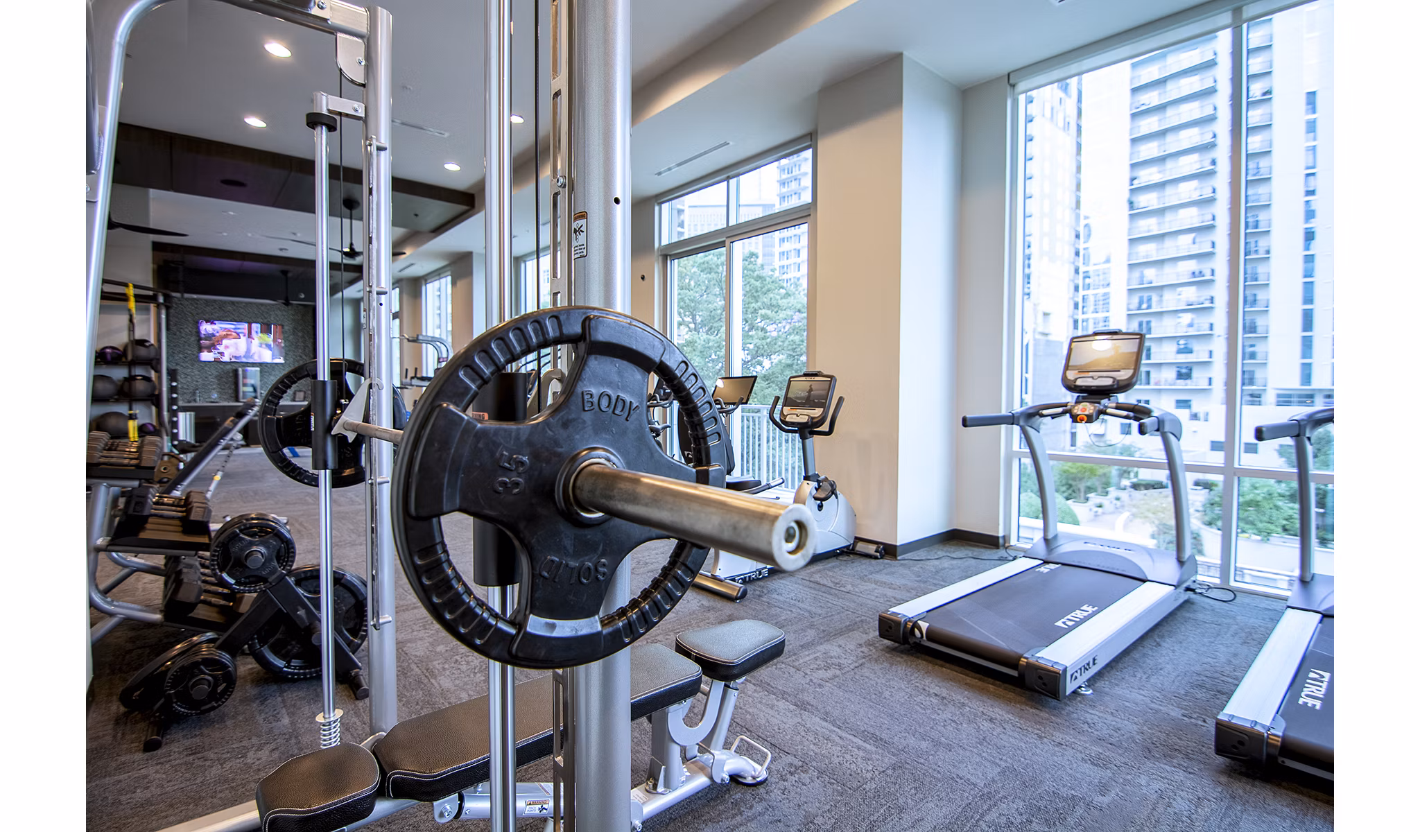 Modern fitness center with state-of-the-art equipment at Piedmont House Apartments