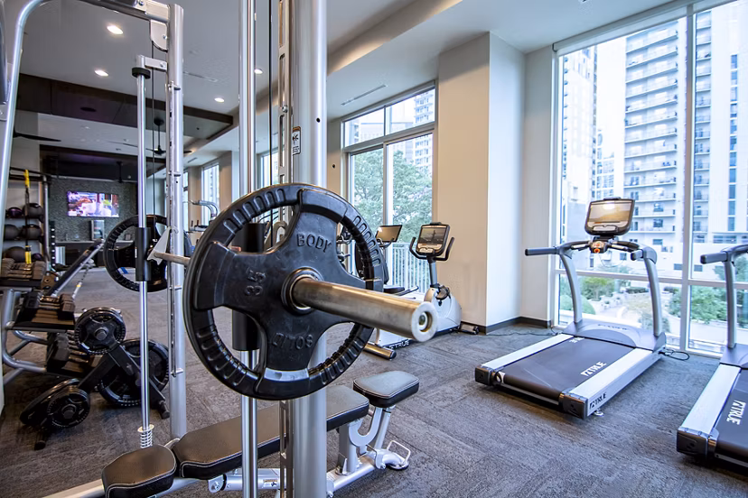 Modern fitness center with state-of-the-art equipment at Piedmont House Apartments