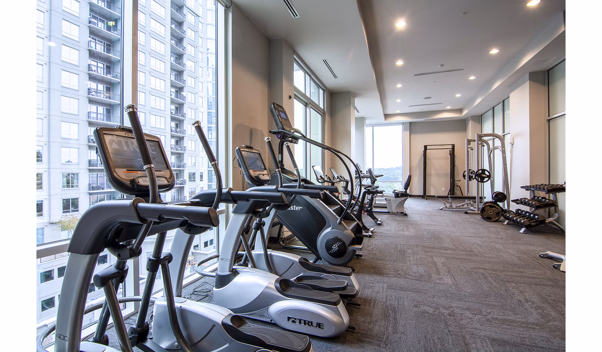 Modern fitness center with state-of-the-art equipment at Piedmont House Apartments