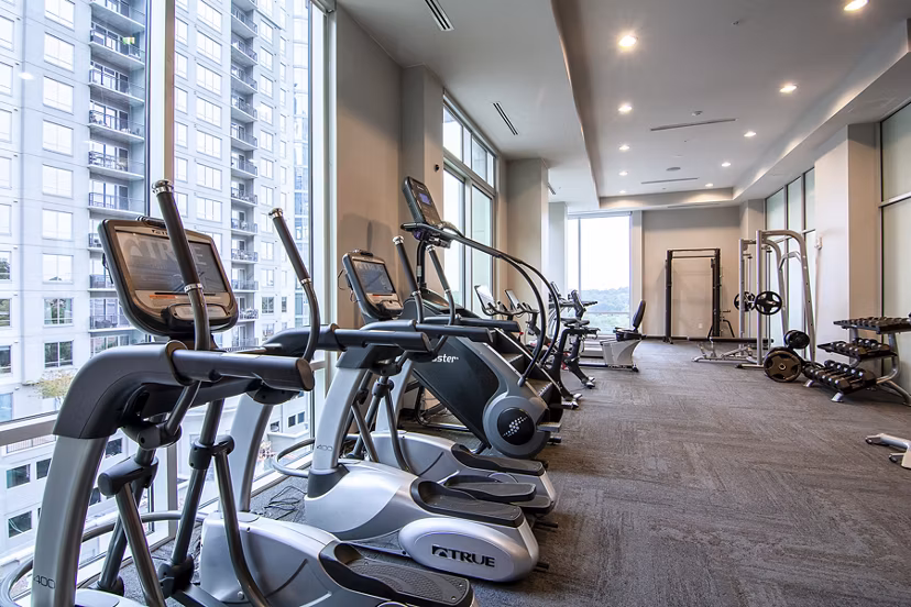 Modern fitness center with state-of-the-art equipment at Piedmont House Apartments