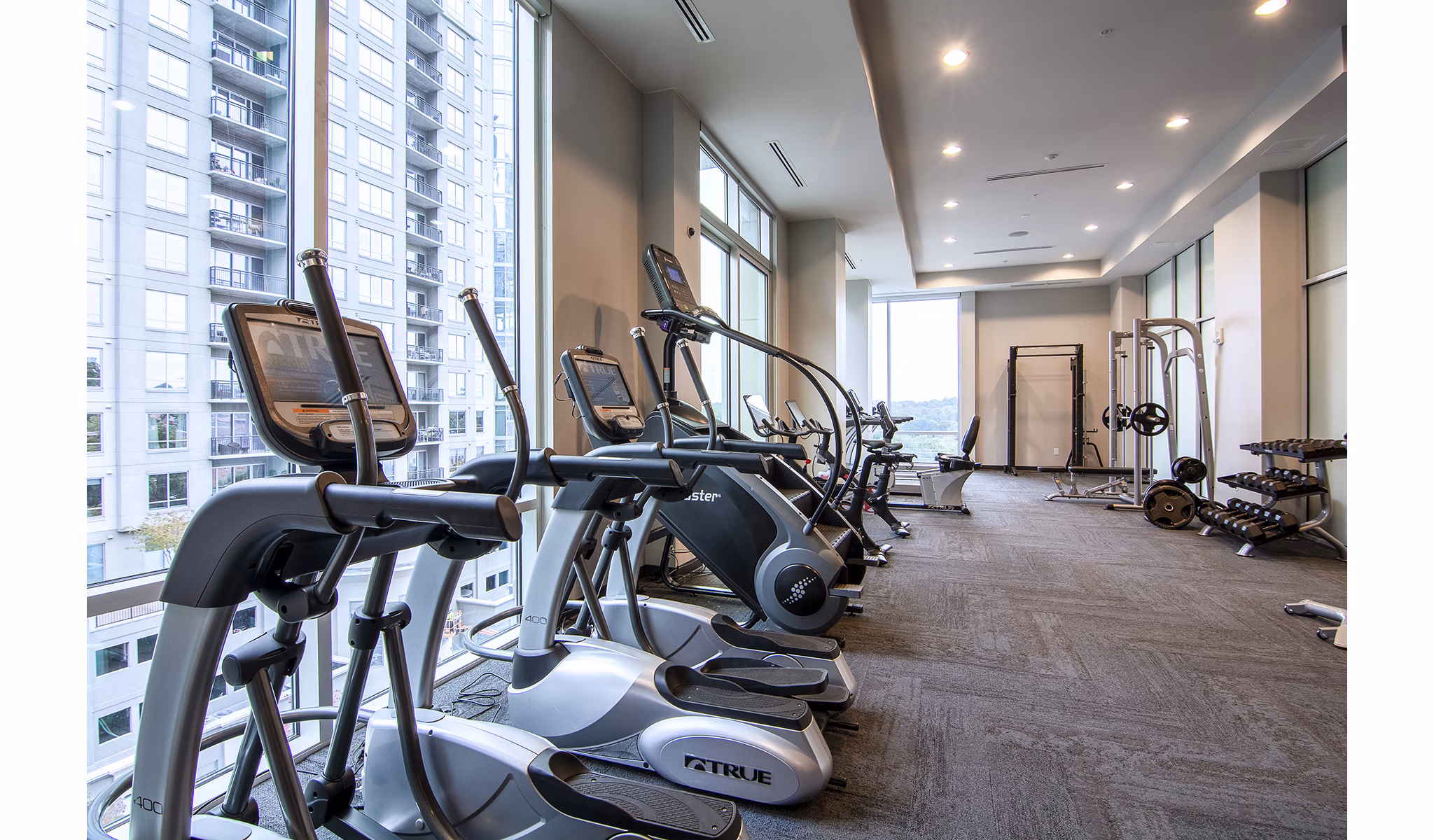 Modern fitness center with state-of-the-art equipment at Piedmont House Apartments