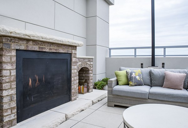 Rooftop lounge with fire pit at Piedmont House Apartments offering luxury living spaces
