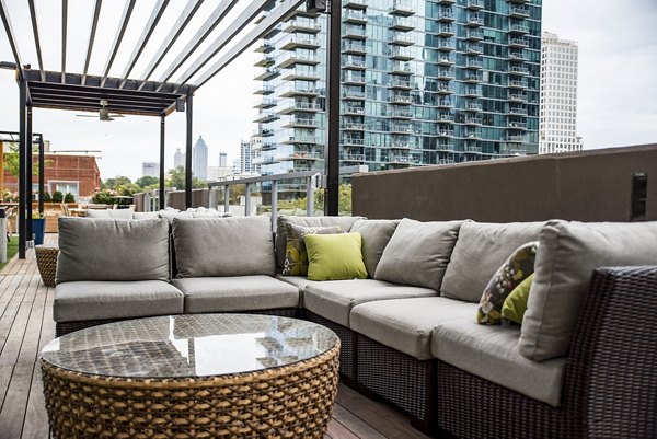 Cozy patio balcony at Piedmont House Apartments with comfortable seating for relaxation and enjoying outdoor views