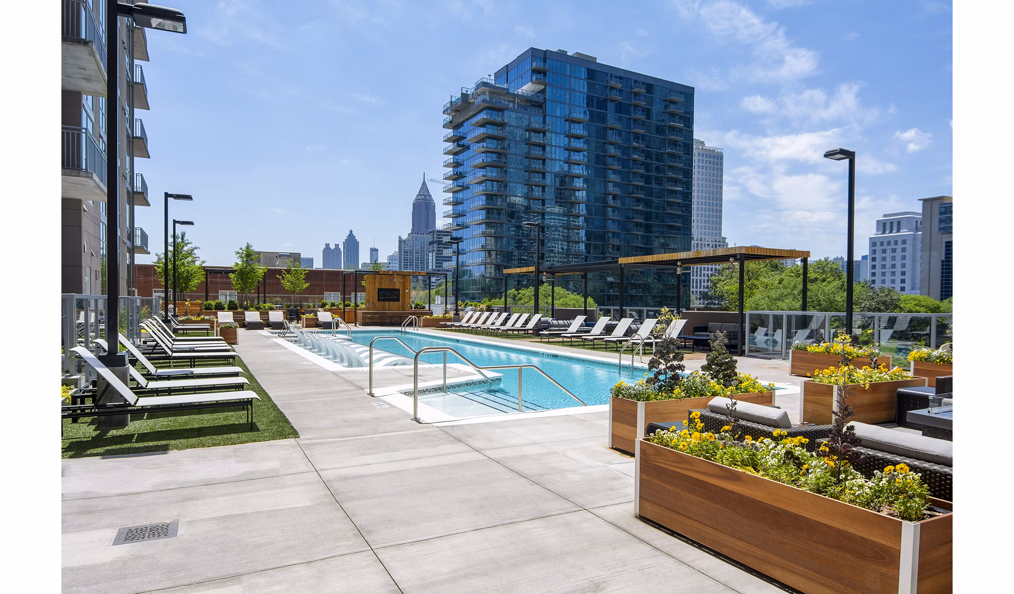 Resort-style pool with lounge chairs at Piedmont House Apartments in Atlanta