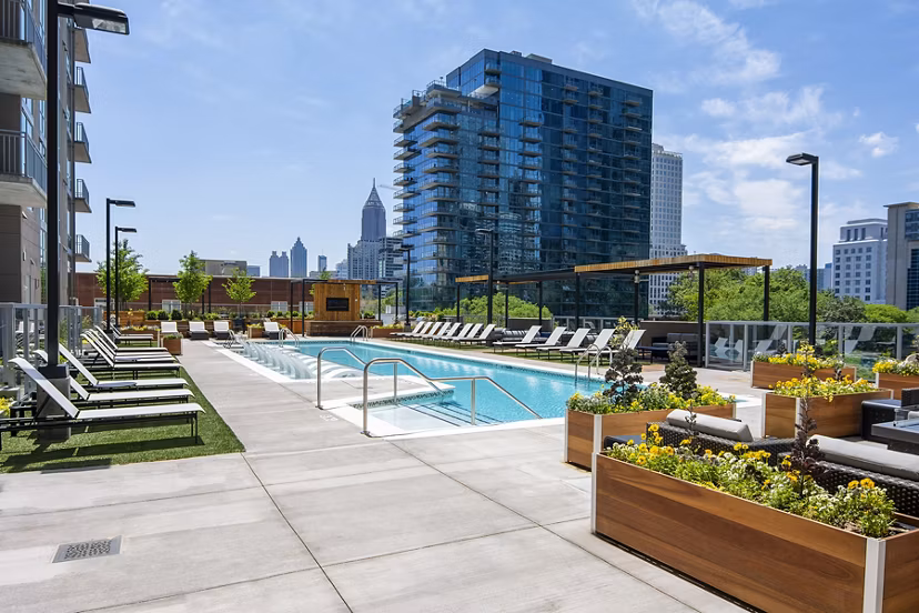 Resort-style pool with lounge chairs at Piedmont House Apartments in Atlanta