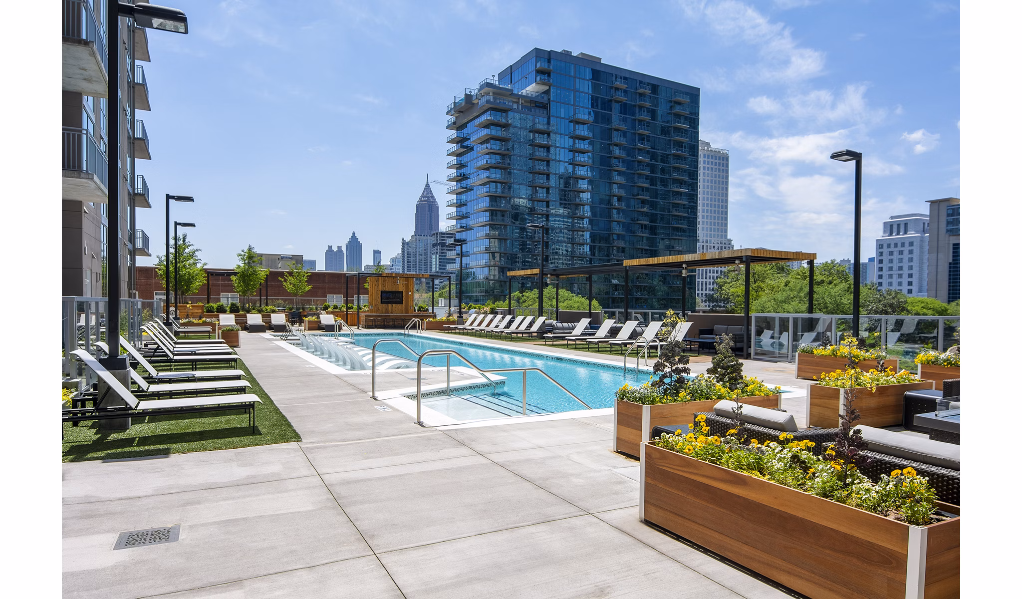 Resort-style pool with lounge chairs at Piedmont House Apartments in Atlanta