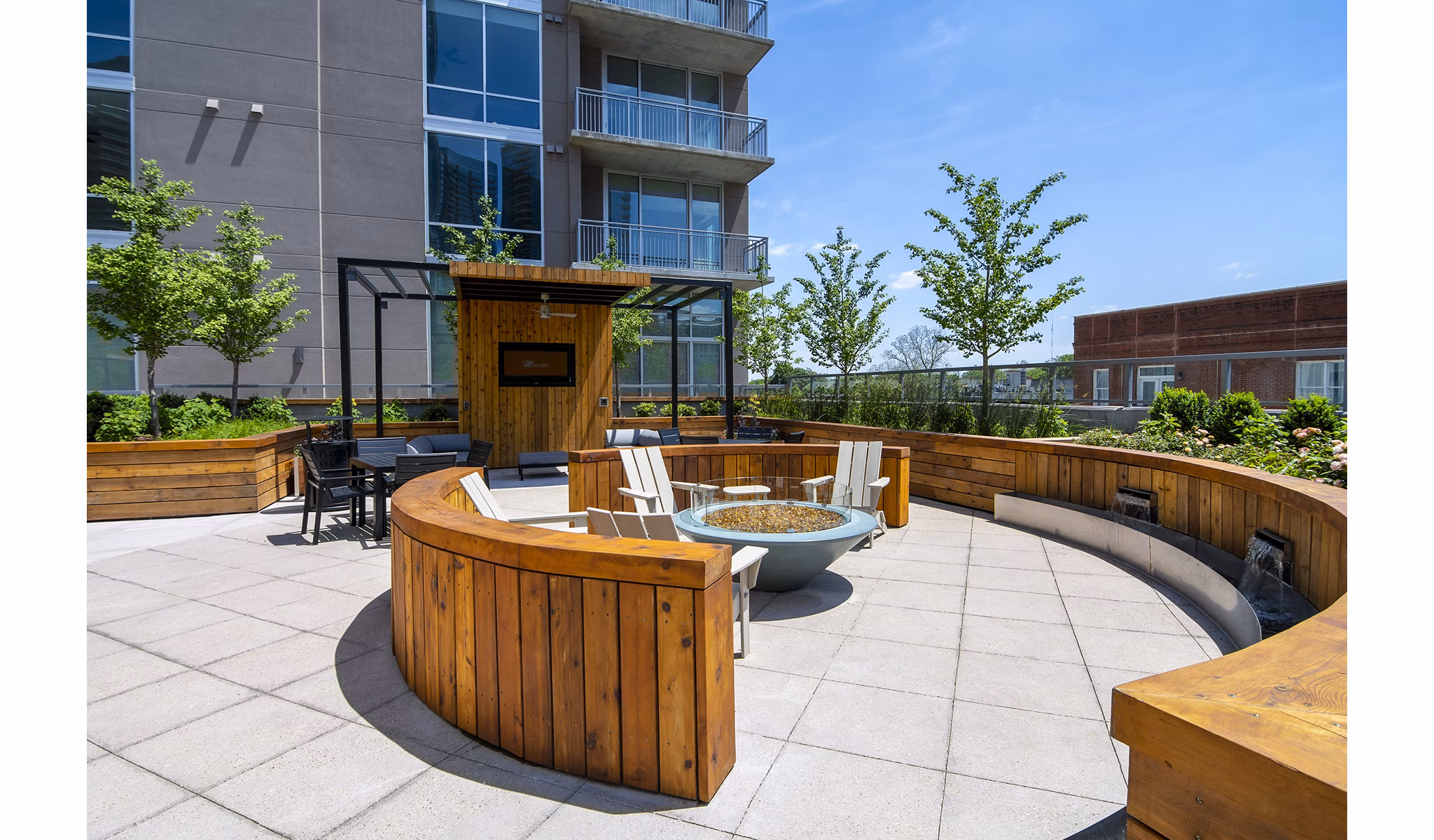Piedmont House Apartments: Cozy patio balcony with modern seating and lush greenery, offering serene outdoor living space
