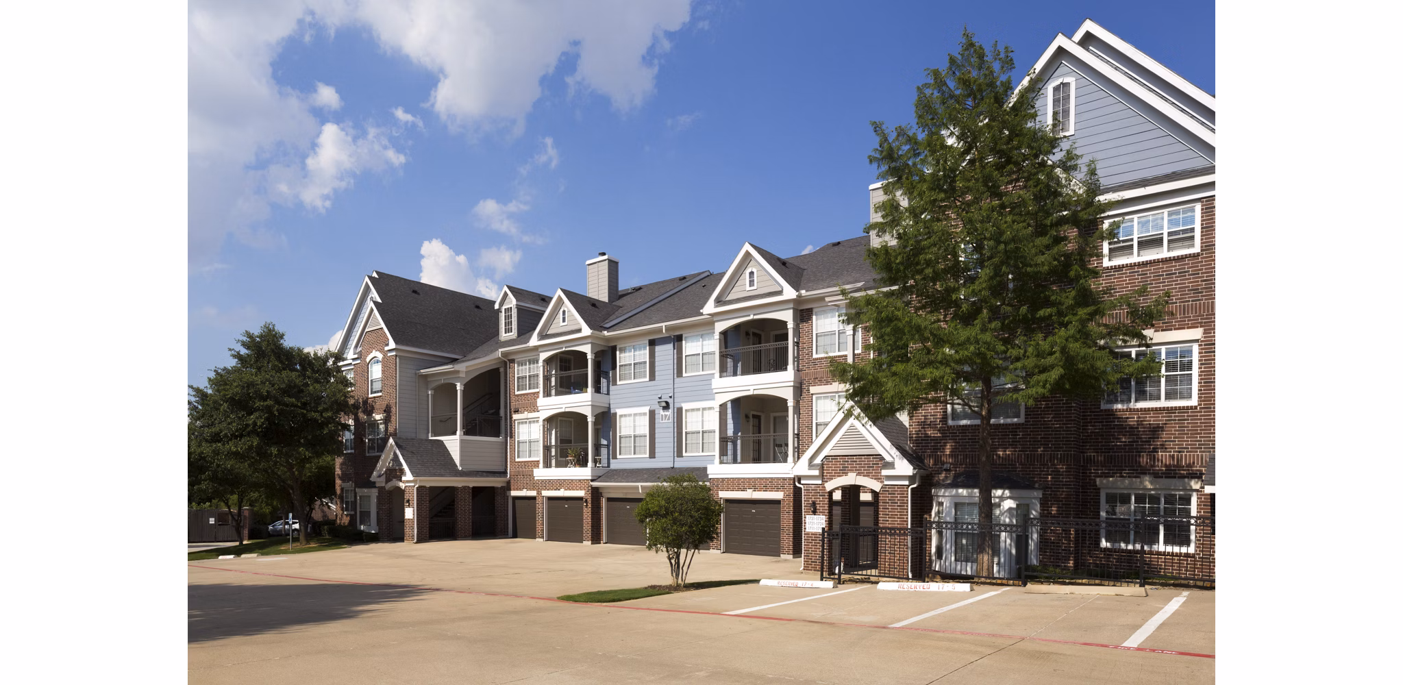 Grapevine TwentyFour 99: Luxe view of apartment complex in Grapevine