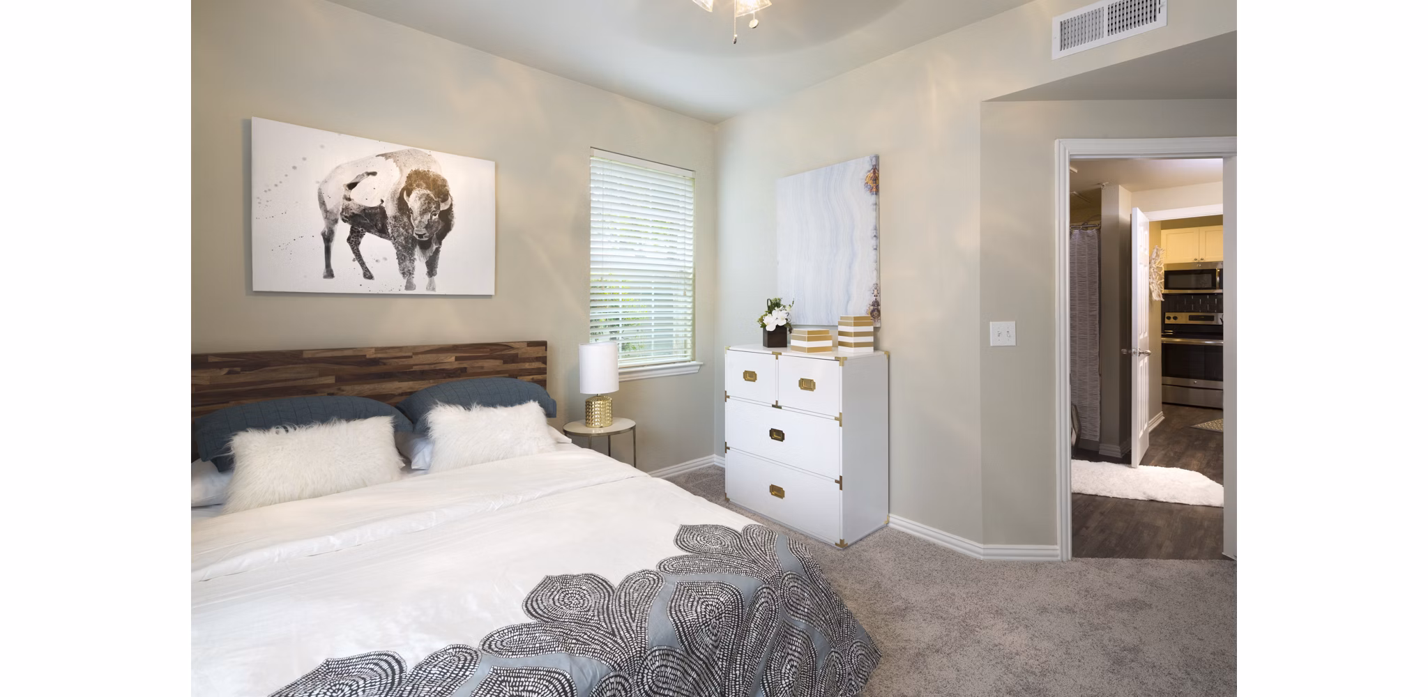 Cozy bedroom with modern decor at Grapevine TwentyFour 99 Apartments