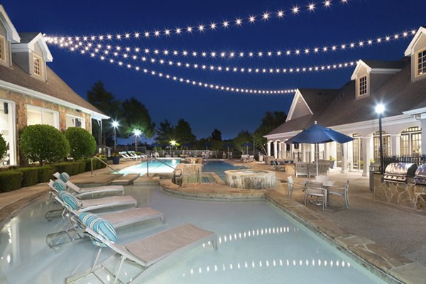 Chic pool area at Grapevine TwentyFour 99 Apartments with luxurious lounging and vibrant landscaping