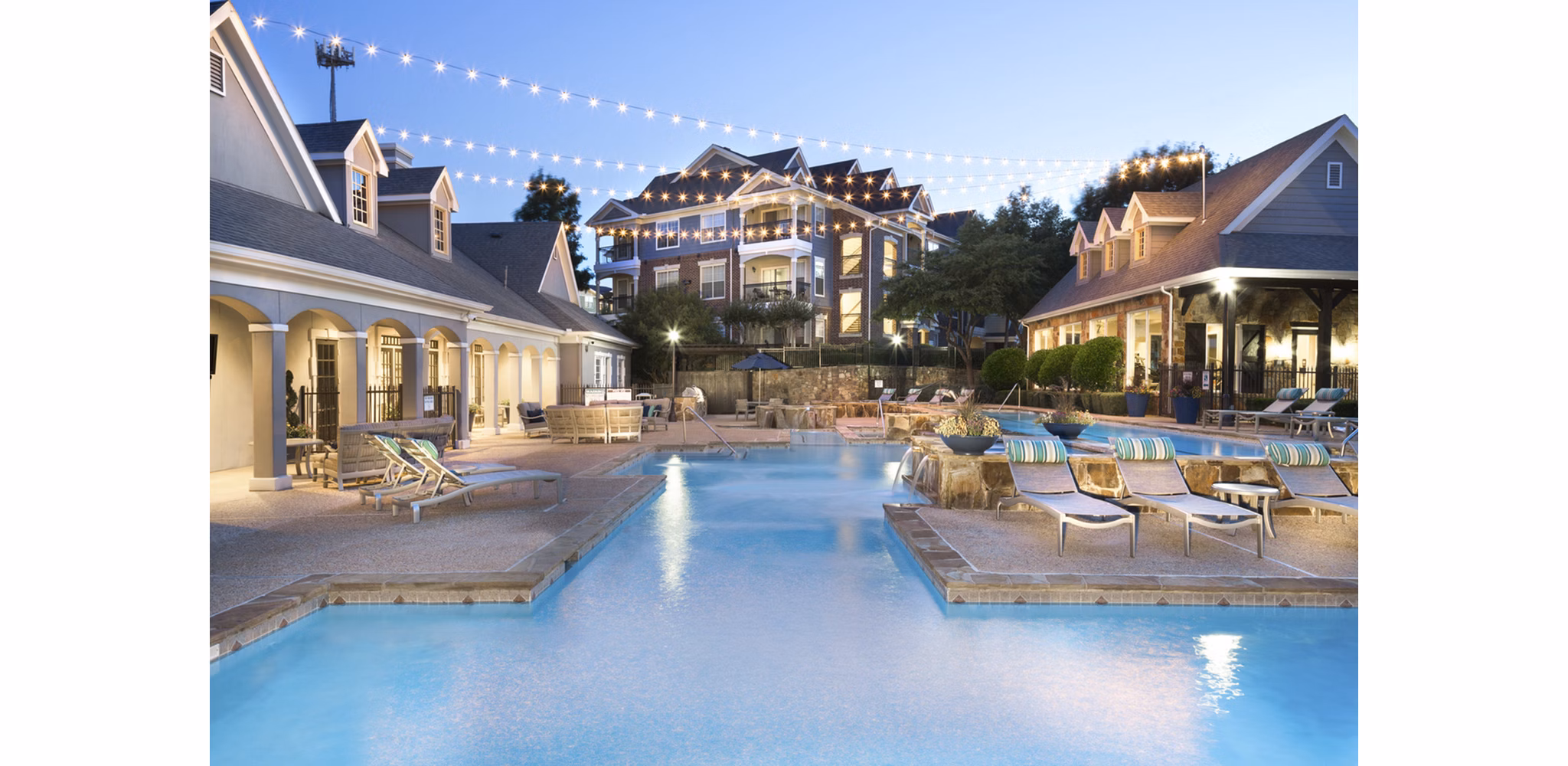Resort-style swimming pool at Grapevine TwentyFour 99 Apartments, offering luxurious outdoor relaxation in a serene setting