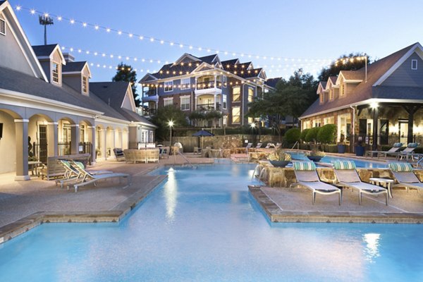 Resort-style swimming pool at Grapevine TwentyFour 99 Apartments, offering luxurious outdoor relaxation in a serene setting