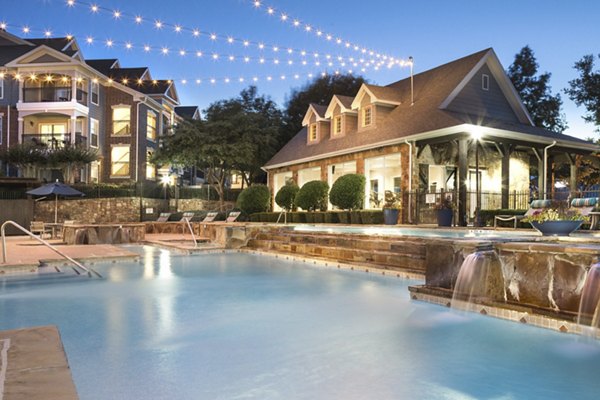 Resort-style pool area at Grapevine TwentyFour 99 Apartments offering luxury relaxation and leisure amenities