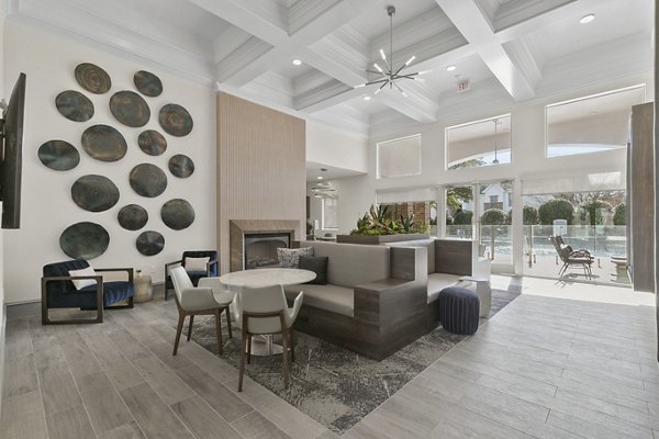 Clubhouse featuring modern decor and spacious seating at Eleven11 Lexington at Flower Mound Apartments