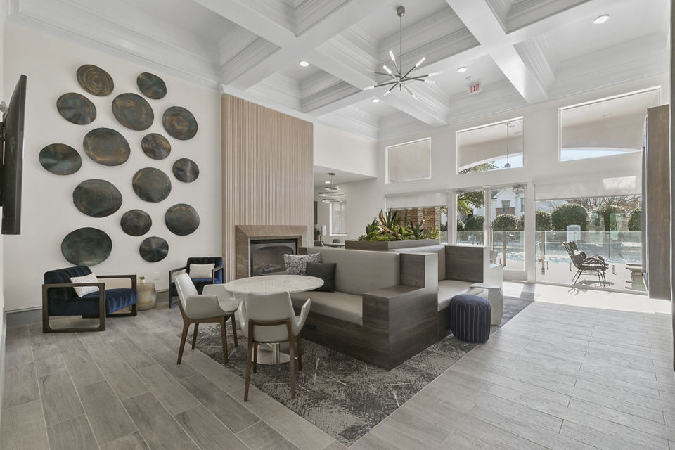 Clubhouse featuring modern decor and spacious seating at Eleven11 Lexington at Flower Mound Apartments