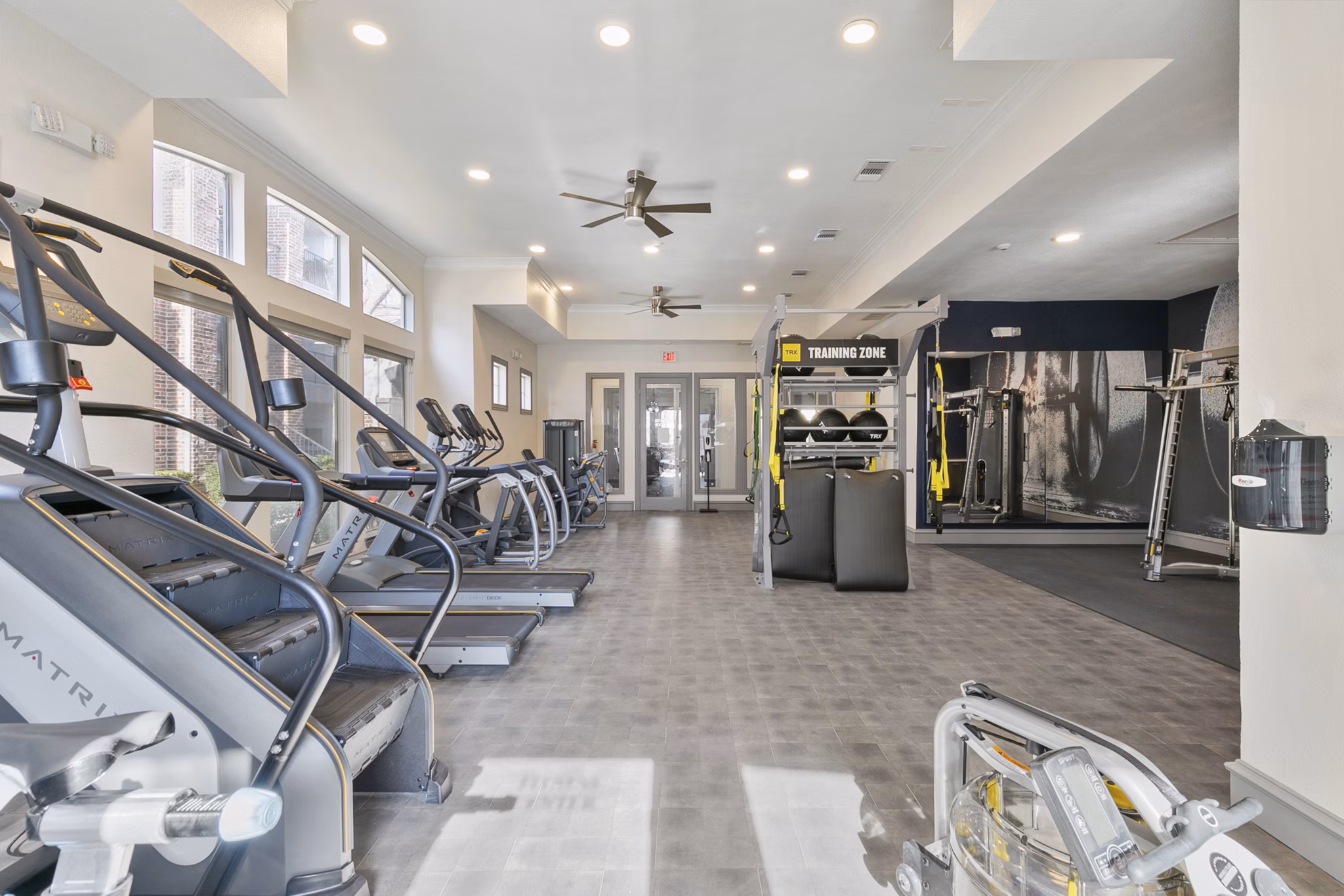State-of-the-art fitness center with modern exercise equipment at Eleven11 Lexington at Flower Mound Apartments