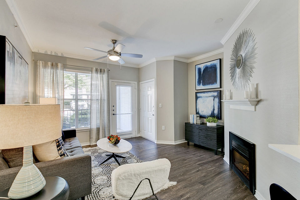Contemporary living room with natural light at Eleven11 Lexington at Flower Mound Apartments
