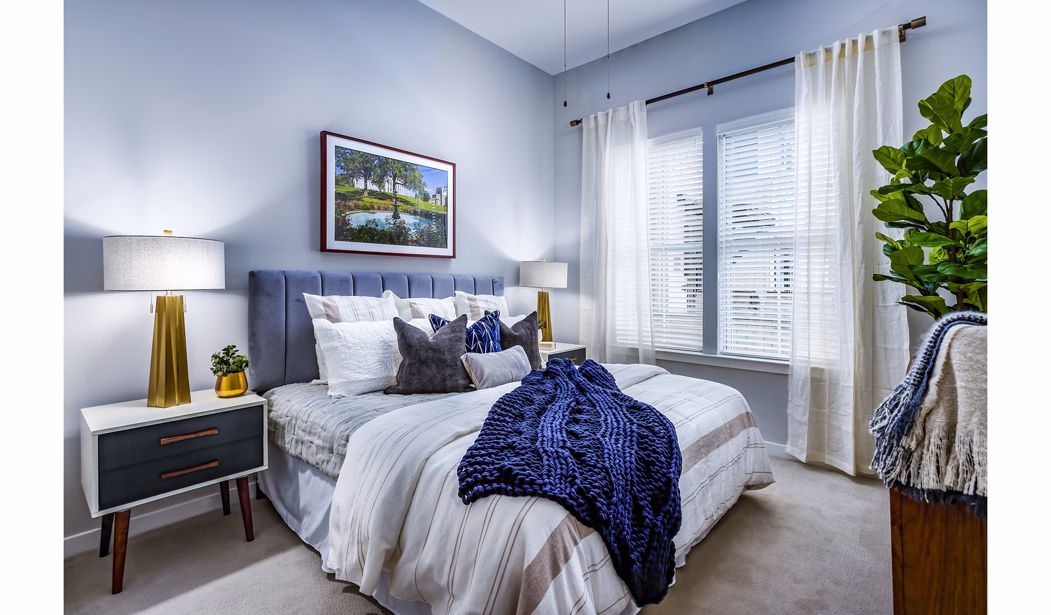 Cozy bedroom with modern decor at Everleigh Short Pump Apartments, luxury living in a vibrant community