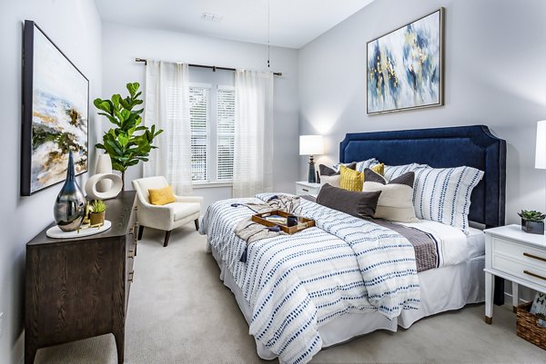 Cozy bedroom with elegant decor in Everleigh Short Pump Apartments