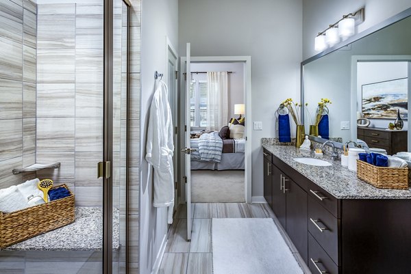 Bathroom with modern fixtures and elegant design at Everleigh Short Pump Apartments, offering luxury living in a stylish environment