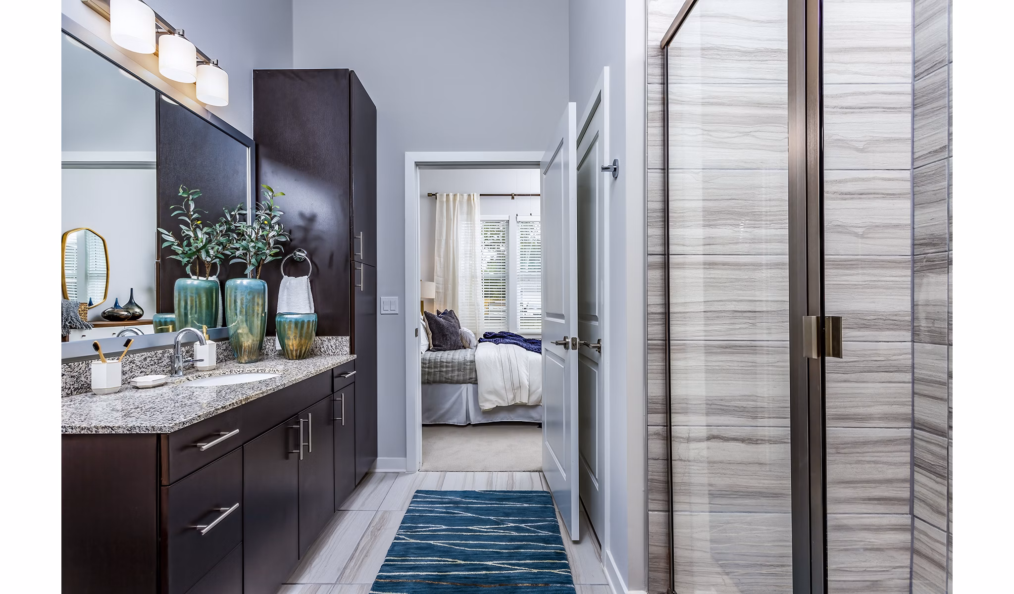Bathroom with sleek fixtures and modern design at Everleigh Short Pump Apartments