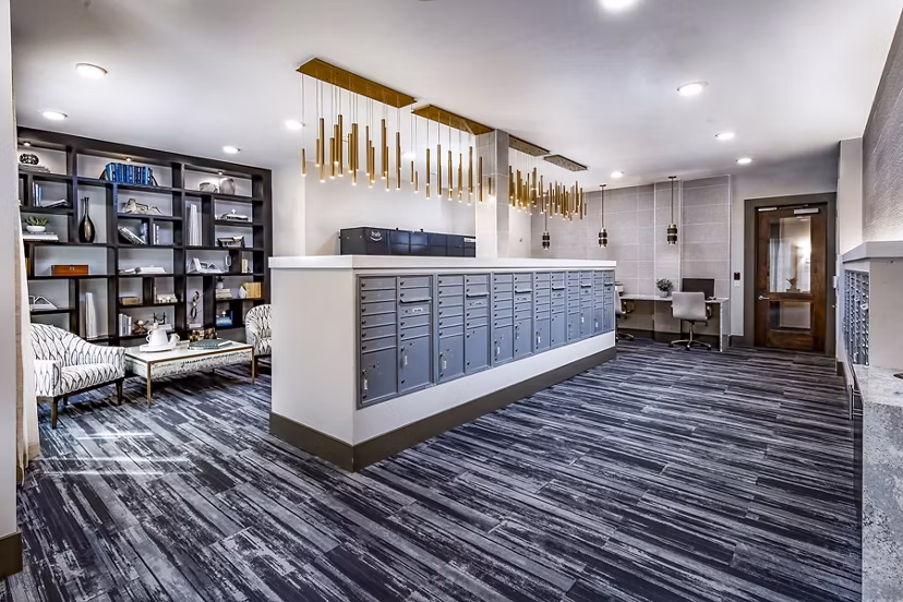 Modern mail room with secure package lockers at Everleigh Short Pump Apartments, fostering convenient package handling for residents