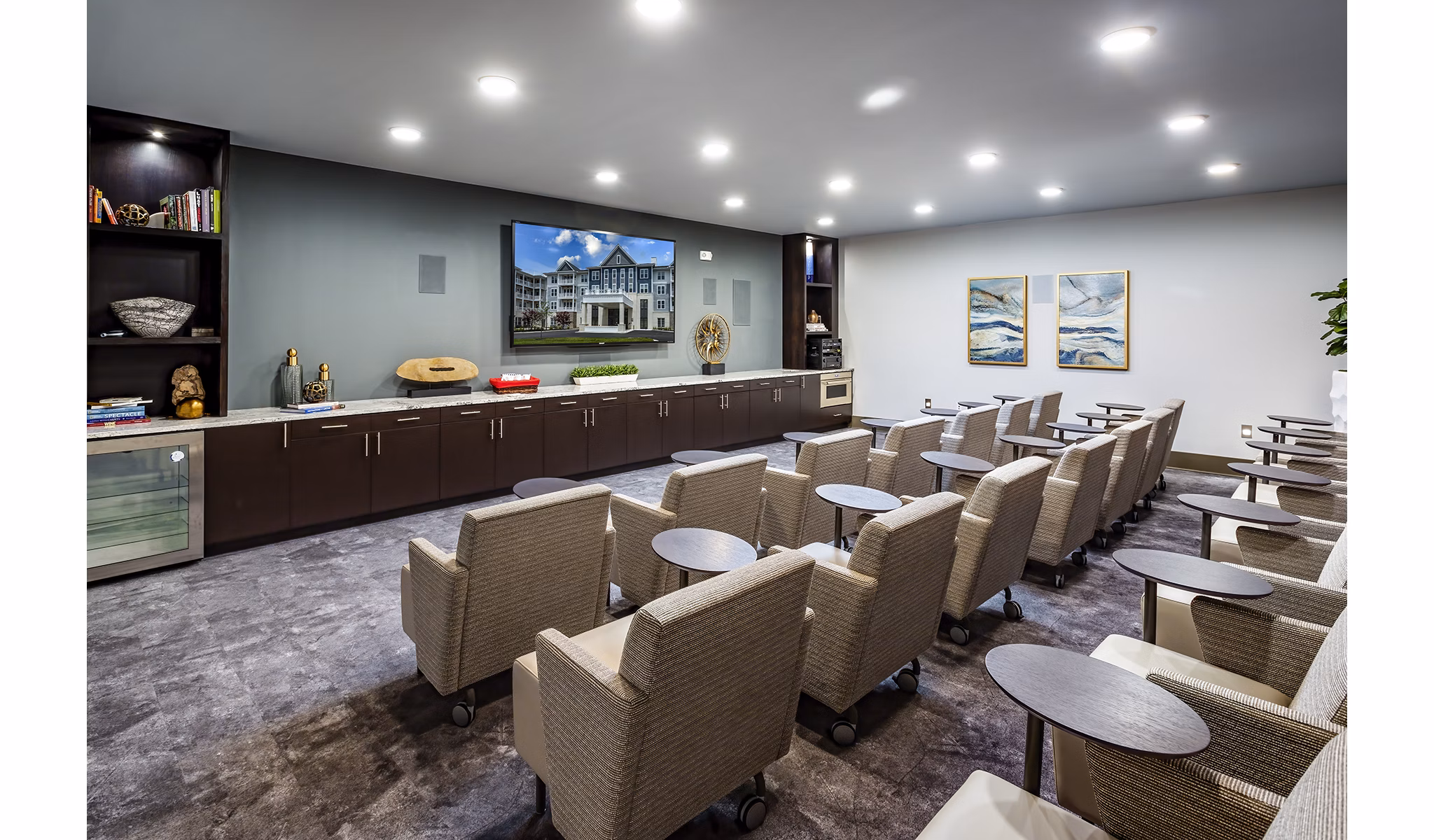 Theater room with plush seating and large screen at Everleigh Short Pump Apartments