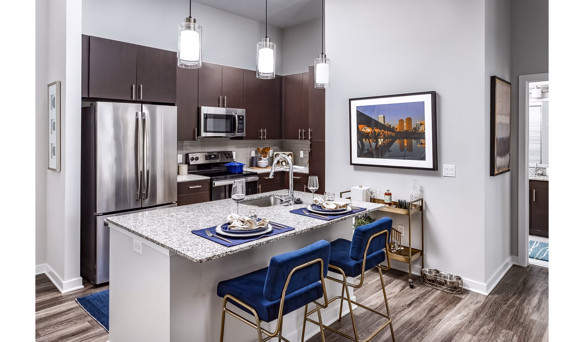 Contemporary kitchen with sleek countertops and stainless steel appliances at Everleigh Short Pump Apartments