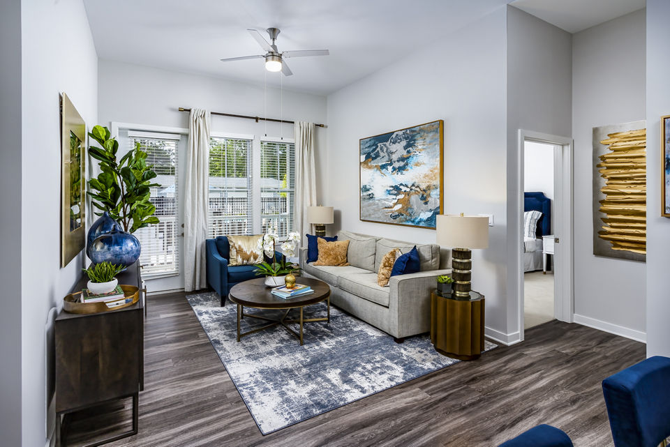 Living room with modern decor and natural light at Everleigh Short Pump Apartments
