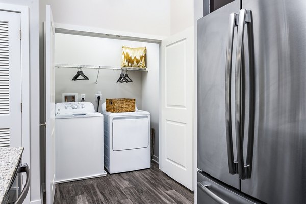 Laundry room with modern appliances at Everleigh Short Pump Apartments, a Greystar luxury community in Richmond, Virginia