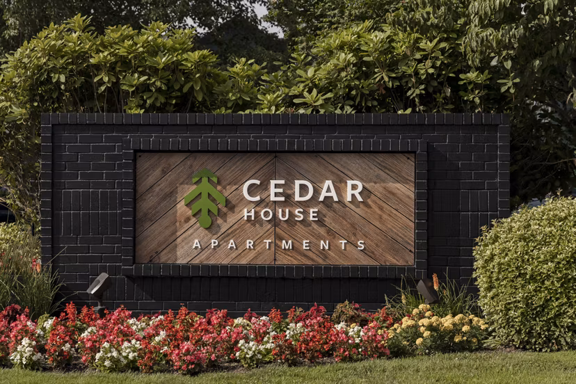 Cedar House Apartments: Signage at luxury apartments in vibrant urban setting