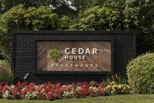 Cedar House Apartments: Signage at luxury apartments in vibrant urban setting