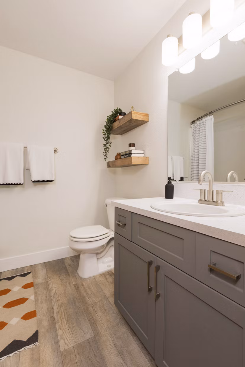 Bathroom featuring sleek fixtures and modern tiles at Cedar House Apartments
