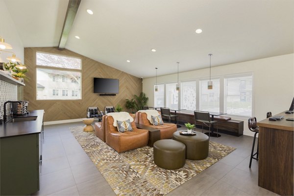 Clubhouse at Cedar House Apartments featuring luxury amenities including a lounge area and game room in vibrant community