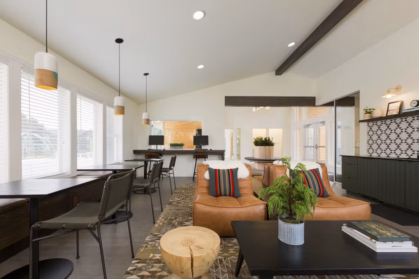Clubhouse offering a modern lounge and entertainment space at Cedar House Apartments