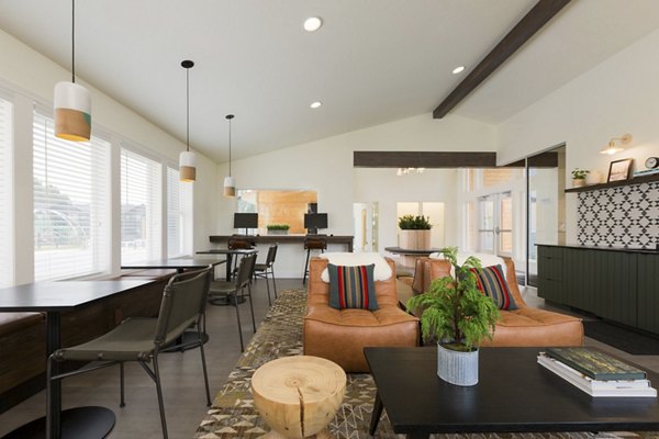 Clubhouse offering a modern lounge and entertainment space at Cedar House Apartments