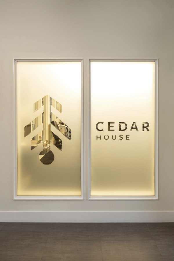 Clubhouse with modern design and lounge seating at Cedar House Apartments, a luxury Greystar community