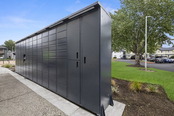 Mailroom featuring organized parcel lockers at Cedar House Apartments