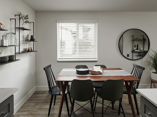 Dining area featuring modern decor and ample seating in Cedar House Apartments