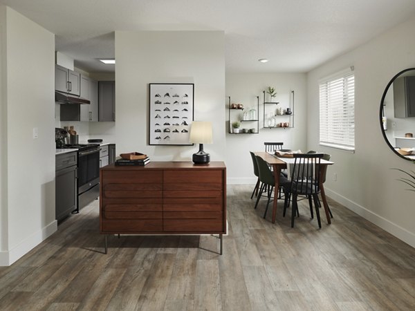 Contemporary kitchen with stainless steel appliances in Cedar House Apartments