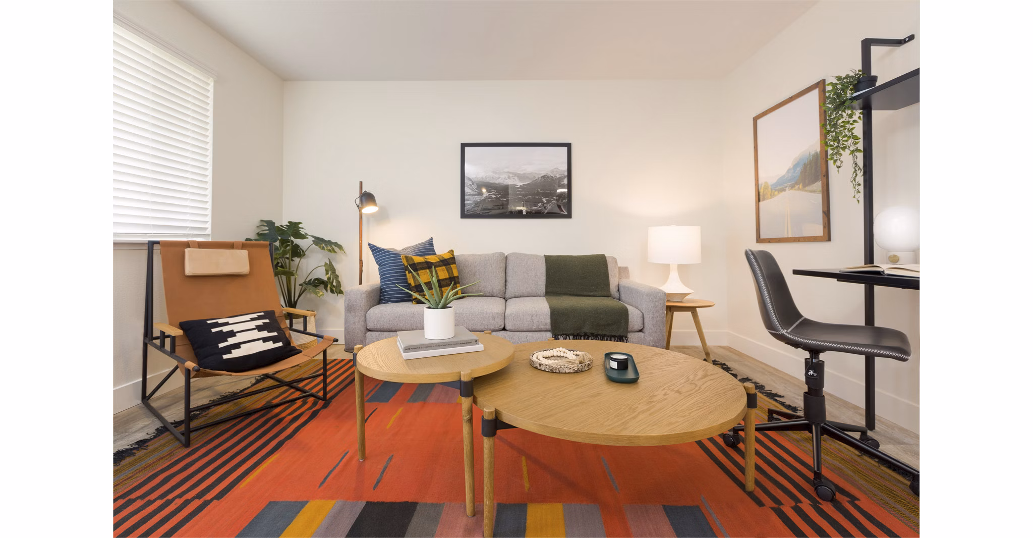 Spacious living room with modern decor in Cedar House Apartments