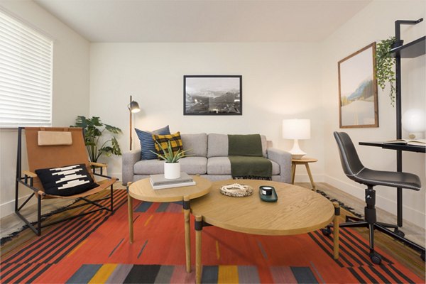 Spacious living room with modern decor in Cedar House Apartments