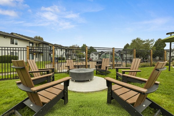 Cozy fire pit seating area at Cedar House Apartments