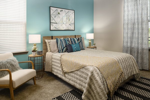 Elegant bedroom with modern furnishings and natural light at Sapphire Bay Apartments, offering a luxurious living experience