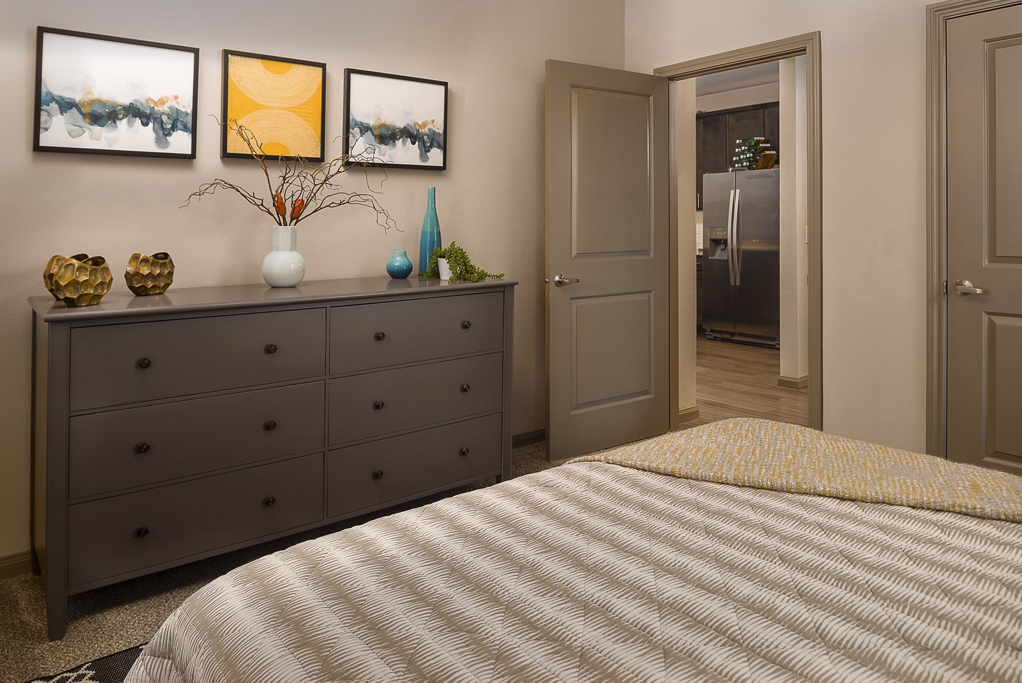 Cozy bedroom with modern decor at Sapphire Bay Apartments, a luxury Greystar property