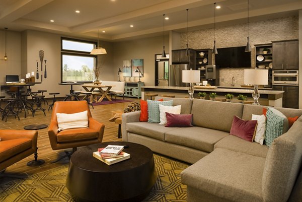 Sapphire Bay Apartments: Modern clubhouse with elegant design and ample seating areas