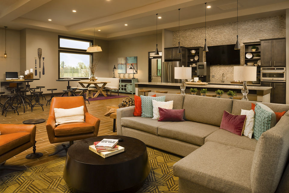 Sapphire Bay Apartments: Modern clubhouse with elegant design and ample seating areas