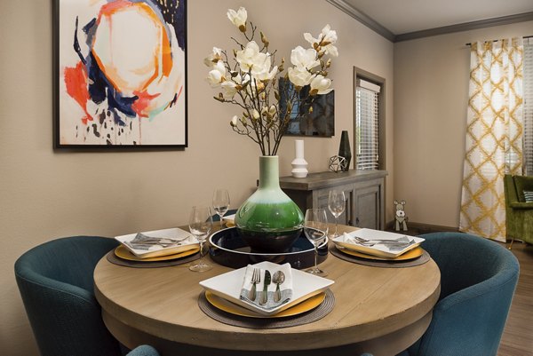 Modern dining room with sleek furniture in Sapphire Bay Apartments, ideal for hosting meals and gatherings in a luxury setting