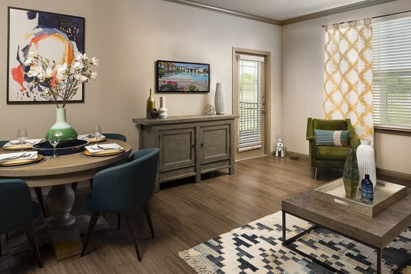 â€œElegant dining room with modern decor at Sapphire Bay Apartmentsâ€