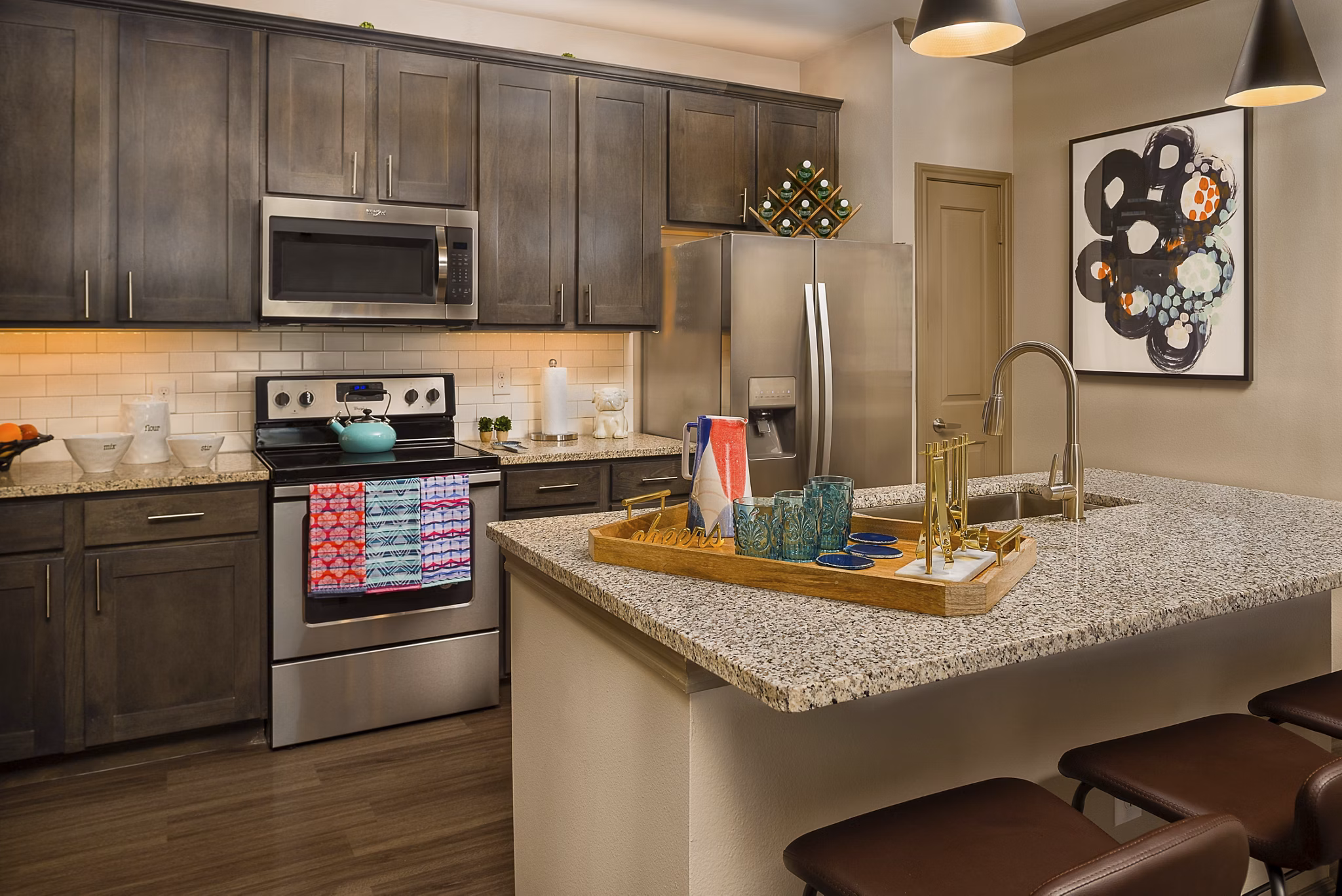 Modern kitchen with stainless steel appliances at Sapphire Bay Apartments